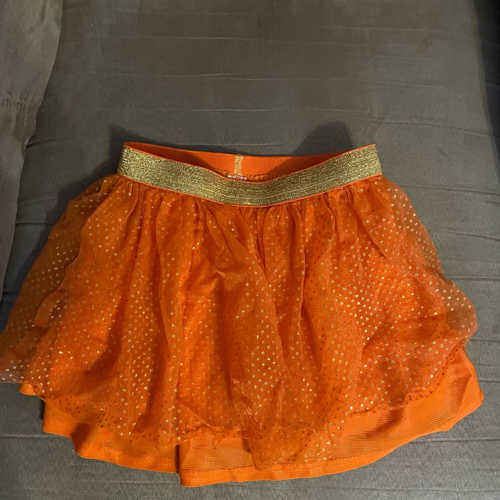 Two Tutu’s. Army green with patriotic stars and an orange.
